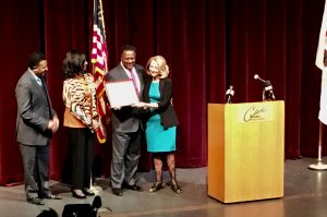 Walker Family Accepts Award from Mayor Julie Moore Wolfe